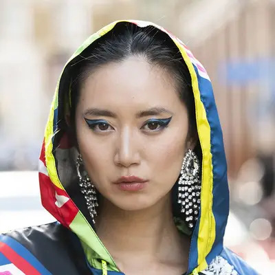 Model Betty Bachz in graphic blue and black eyeliner