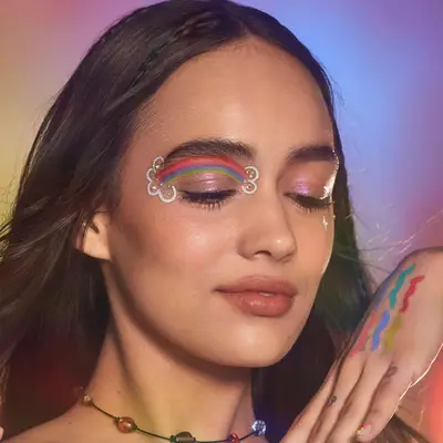 A makeup look with a rainbow on one eye