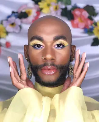 model is wearing pastel shadows on the lids in yellow, green, blue and pink