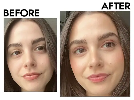 Hand applying HUDA BEAUTY GloWish Multidew Vegan Skin Tint Foundation to the back of other hand