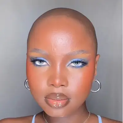 Woman with blue eyes and a light blue eyeshadow.