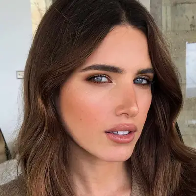 Woman with blue eyes and a soft, smoky brown eyeshadow look.