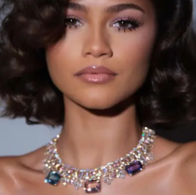 zendaya wearing jeweled necklace and long eyelashes