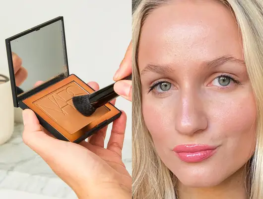 A compact bronzer being applied with a brush, and a woman