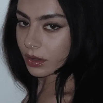 Charli XCX wearing smudged eyeliner