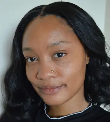 woman applying milk hydrogrip primer