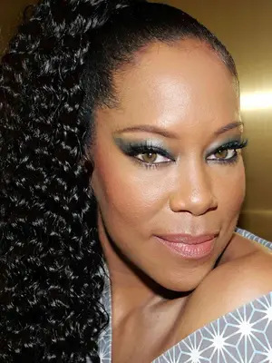 regina king in smoky eye and ponytail