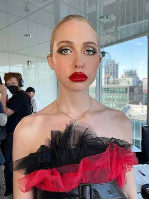 model with cut crease and bright red lips