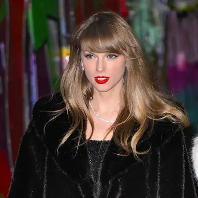 Taylor Swift leaves The Box on her birthday in bright red lipstick