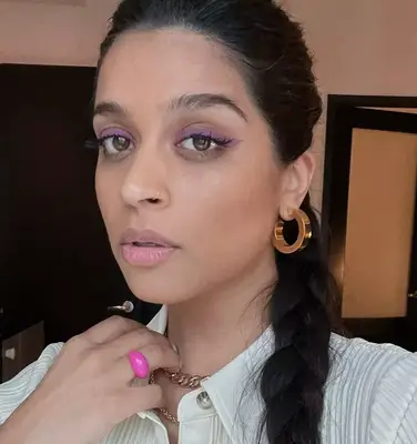 up close picture of lilly singh wearing soft lilac winged eyeliner