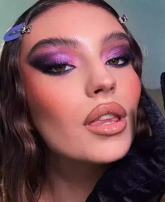 up close photo of a model wearing a smoky lilac and purple eyeshadow look 
