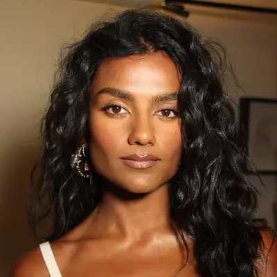 Simone Ashley with a softly sculpted face and dark nude lip