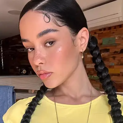 woman with faux freckles and glossy lips