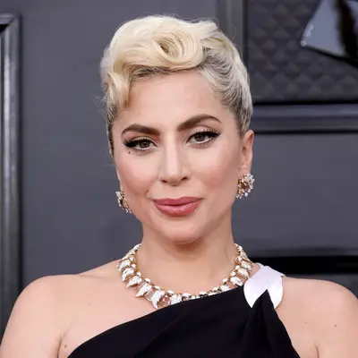 Lady Gaga with blonde rolled updo and winged eyeliner attends the 64th Annual GRAMMY Awards