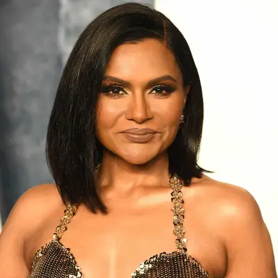 Mindy Kaling with smokey eye makeup and sleek lob at the Vanity Fair Oscar Party
