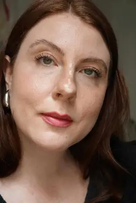 model has highlighter applied down the bridge of the nose and on the tip