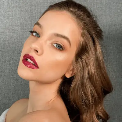 Barbara Palvin with champagne shimmer eyeshadow and a deep berry plum lipstick.