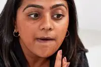 Person applying KVD Beauty Good Apple Skin-Perfecting Hydrating Foundation Balm with their hands