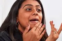 Person applying KVD Beauty Good Apple Skin-Perfecting Hydrating Foundation Balm with their hands