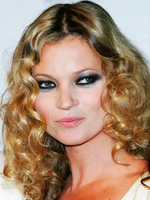 Kate Moss, tight curls and thick eyeliner