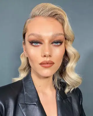 Model wearing negative space winged eyeliner