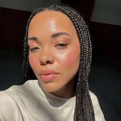 woman wearing baby pink monochrome makeup