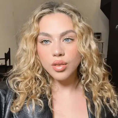 model wearing sheer peach monochrome makeup