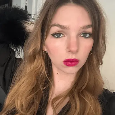Woman wearing the Makeup By Mario SuperSatin lipstick in pink