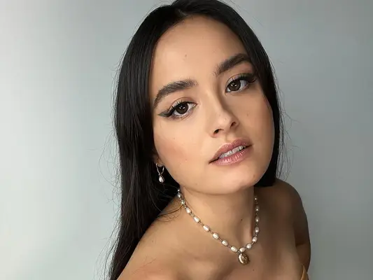 The actor Chase Sui Wonders looking up at the camera, winged liner on her eyes