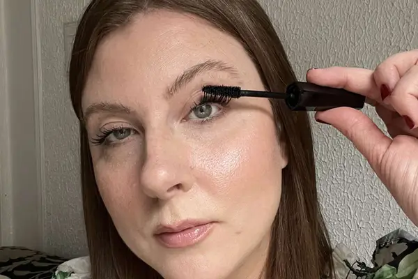 A MYM Beauty writer applying a mascara