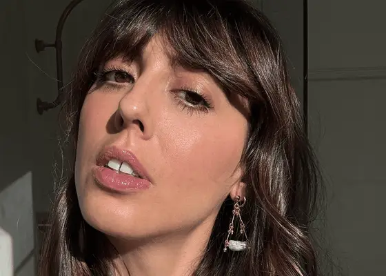 close up of french woman posing for sunlit selfie