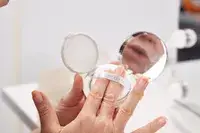 Hand holding Chantecaille Future Skin Cushion Skincare Foundation