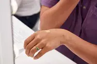 Hand displaying a small amount of Kosas Revealer Skin-Improving Foundation SPF 25