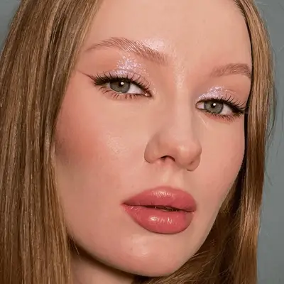 Rosie Huntington-Whitely in profile, head turned to the camera, with black winged eyeliner