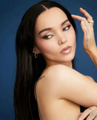 Dove Cameron wears light frosted lips with silver metallic eyeshadow