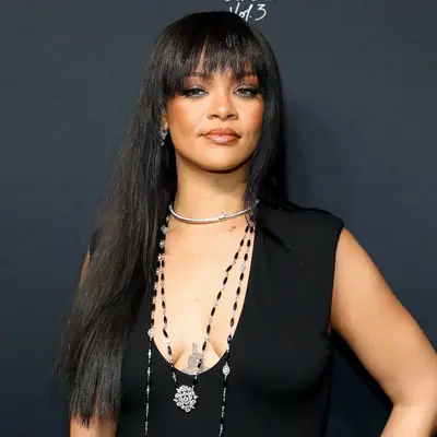 Rihanna wears a neutral makeup look with a subtle smoky eye