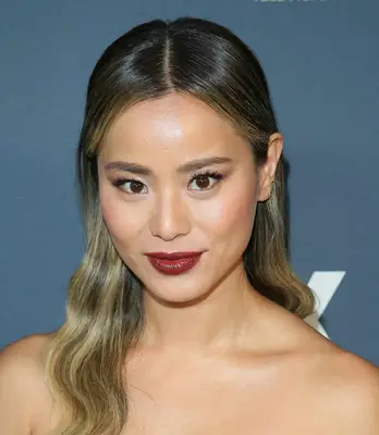 Jamie Chung wears a wine-red lip