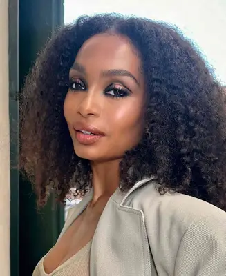Yara Shahidi wears a smoky eye with accentuated black eyeliner