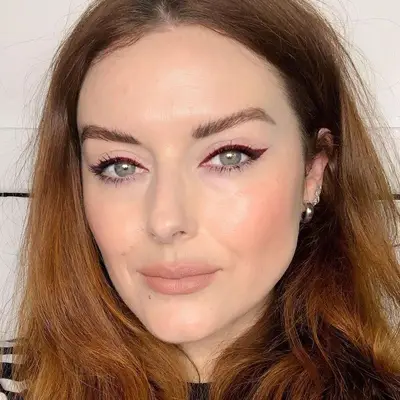 Katie Jane Hughes in maroon red eyeliner