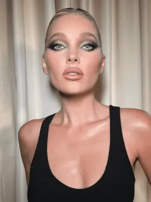 Model wears a smoky grey 60s eyeshadow look