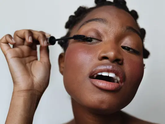 woman applying mascara