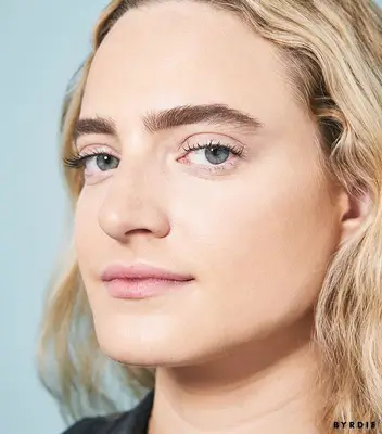 Hallie Gould with eyebrow pencil in brows