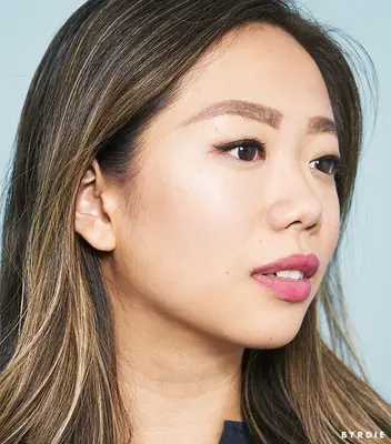 Faith Xue with eyebrow pencil in brows