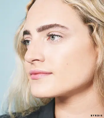 Hallie Gould with eyebrow powder in brows