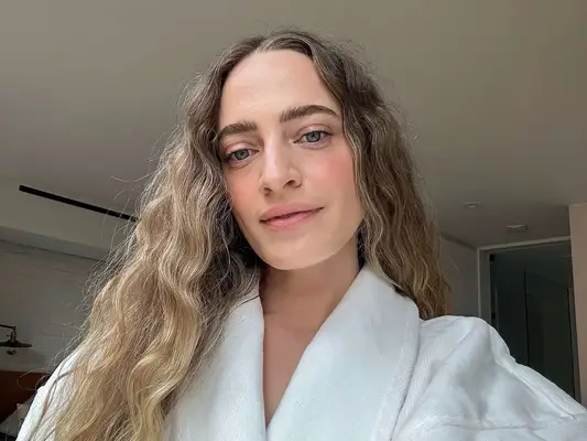 a selfie of byrdie editor in chief hallie gould with bold brows