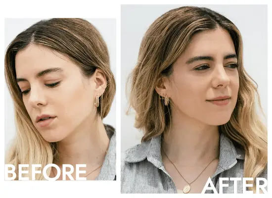 Close-up of a woman combing her eyebrow with a spoolie brush