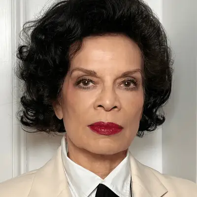 Bianca Jagger in dark red lipstick and purple eyeshadow