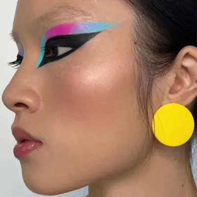 neon pink, black, and blue eye makeup look