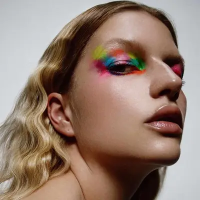 model is wearing bold neon eyeshadow