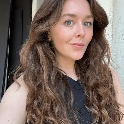 Holly wearing the Kosas Blush Is Life Blush